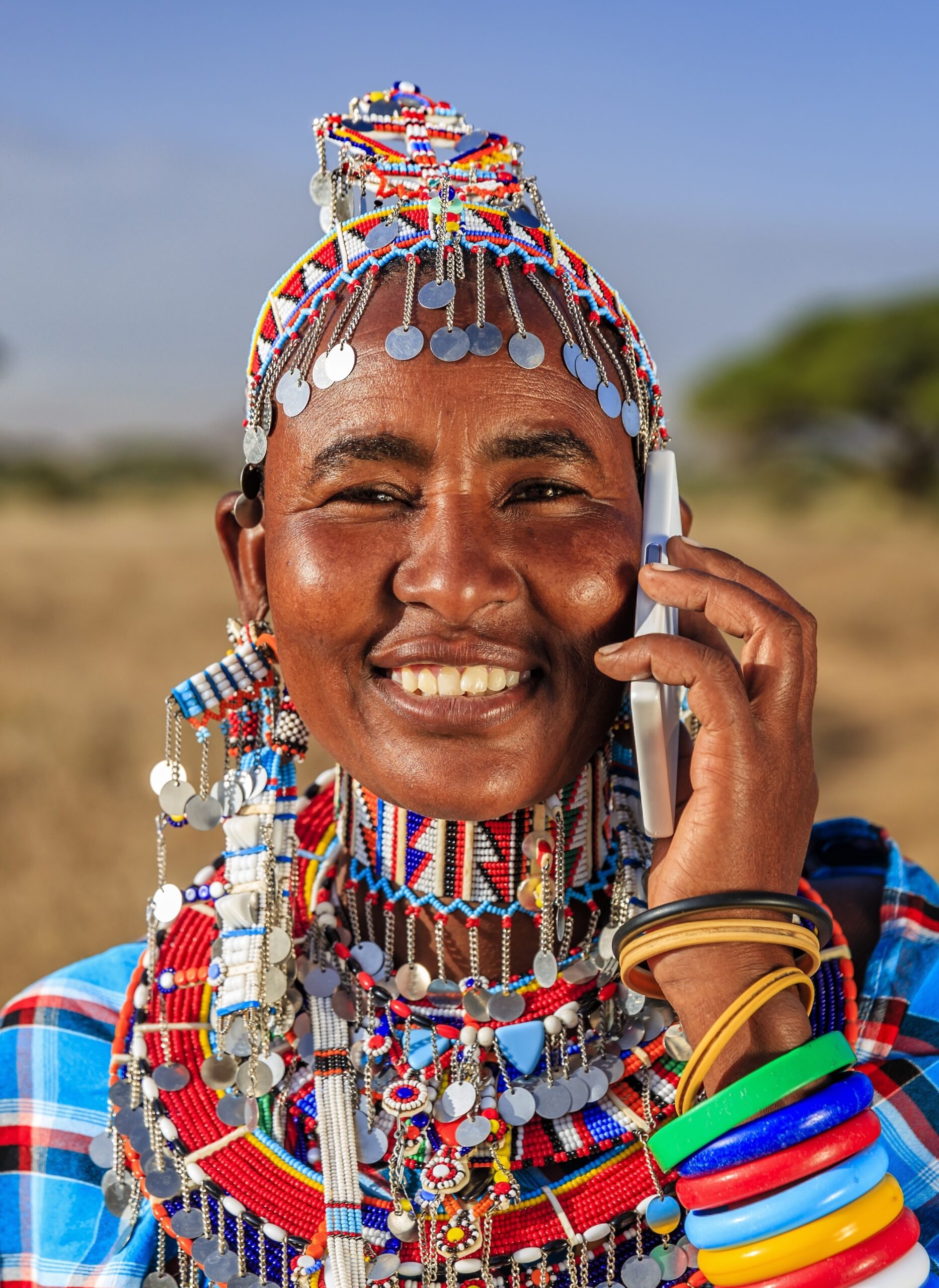 woman from maasai tribe using mobile phone, kenya, africa
